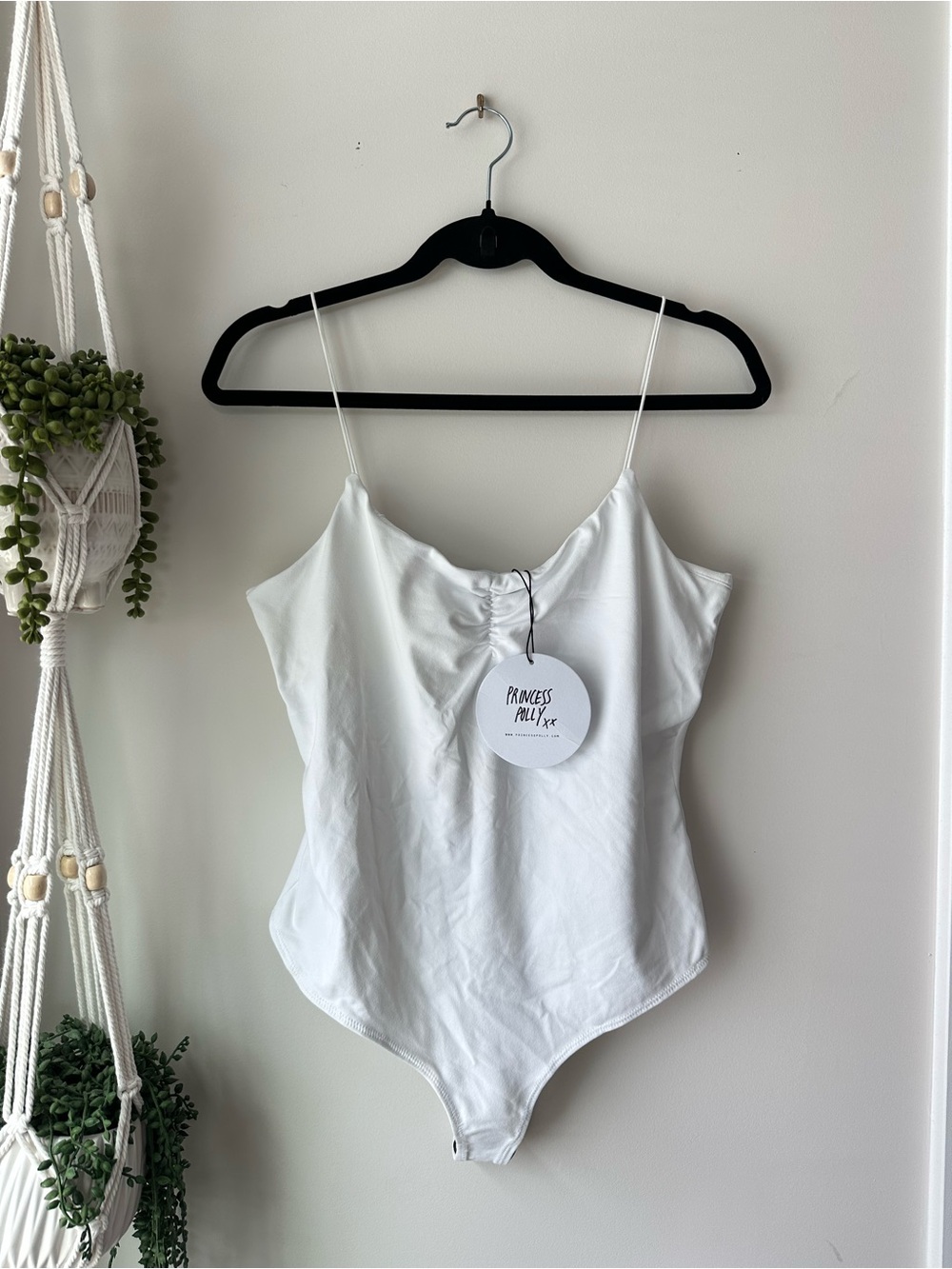 Princess Polly white bodysuit
Size 10
Brand new with tags